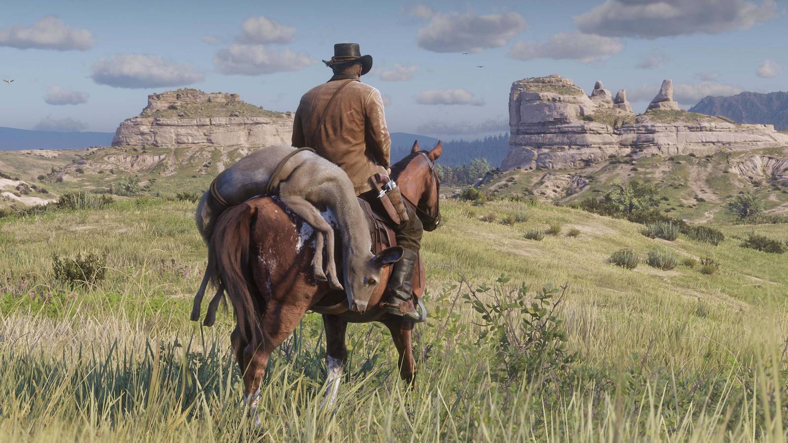 Arthur di Red Dead Redemption 2 in sella al cavallo